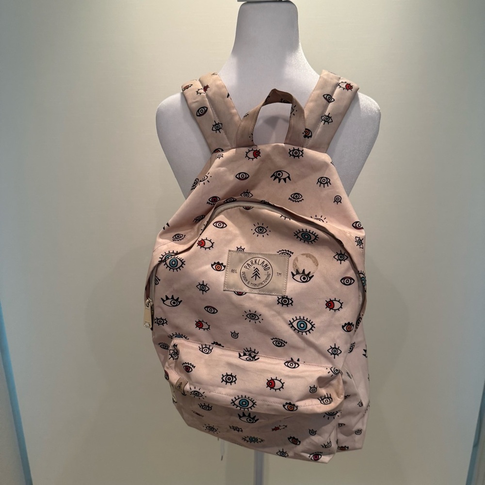 Tan Backpack with Eye Pattern